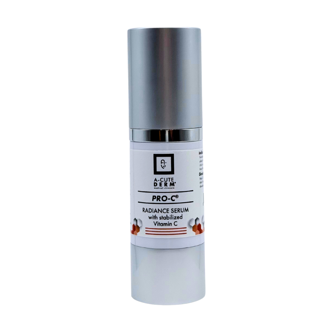 Skincare serum bottle with silver cap and white label on a white background
